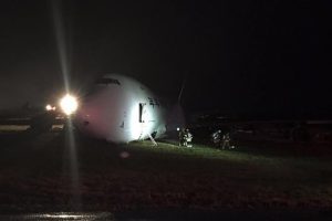 Boeing 747-400F skids off the runway